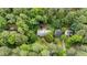 Aerial view of home with lush surroundings, offering tranquility and privacy at 3125 Stanford Dr, Durham, NC 27707