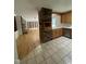 Spacious kitchen with stainless steel appliances and tile flooring, open to living area at 3125 Stanford Dr, Durham, NC 27707