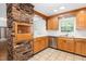 Updated kitchen features stainless steel appliances, tile floors, and granite counters at 3125 Stanford Dr, Durham, NC 27707