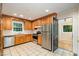 Fully equipped kitchen featuring ample cabinetry, stainless steel appliances, and tile flooring at 3125 Stanford Dr, Durham, NC 27707