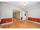 Cozy living space with hardwood floors, colorful wall accents, and easy access to other rooms in the home at 3125 Stanford Dr, Durham, NC 27707