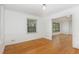 Bright living room features beautiful hardwood floors and neutral white walls and trim at 3125 Stanford Dr, Durham, NC 27707