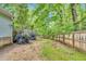Spacious backyard featuring a wooden fence and mature trees at 324 Waterside Dr, Sanford, NC 27330