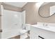 Clean bathroom featuring a white vanity, updated lighting, a tub-shower combo, and neutral paint at 324 Waterside Dr, Sanford, NC 27330