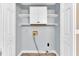 Clean, bright laundry room featuring new laminate floors and washer/dryer hookups at 324 Waterside Dr, Sanford, NC 27330