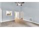Bright living room with vaulted ceilings, neutral paint, updated floors, and a clear view into the kitchen at 324 Waterside Dr, Sanford, NC 27330