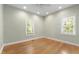 Sunny bedroom with hardwood floors, recessed lighting, and windows that fill the space with natural light at 3359 Denise St, Durham, NC 27704