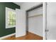 Open closet with shelving and rod, lit by a window and a view at 3359 Denise St, Durham, NC 27704
