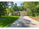 A traditional home features a well-manicured lawn and a two-car garage at 3359 Denise St, Durham, NC 27704