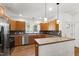 Modern kitchen with stainless steel appliances, granite countertops, and hardwood floors at 3359 Denise St, Durham, NC 27704