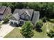 Aerial view of a well-maintained home showcasing its landscaped yard, two-car garage, and serene surroundings at 337 Shadowdale Ln, Rolesville, NC 27571