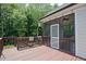 Inviting screened-in back porch with a ceiling fan and access to the backyard at 337 Shadowdale Ln, Rolesville, NC 27571