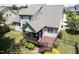 An aerial view of the home's backyard featuring a deck, screened porch, and a well-maintained lawn at 337 Shadowdale Ln, Rolesville, NC 27571