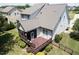 Aerial view of the backyard with a screened porch and wooden deck in a private, fenced yard setting at 337 Shadowdale Ln, Rolesville, NC 27571