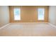 Bright bedroom with neutral carpet and two windows offering lots of light at 337 Shadowdale Ln, Rolesville, NC 27571