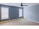 Bedroom featuring neutral walls, carpet flooring and two windows at 337 Shadowdale Ln, Rolesville, NC 27571