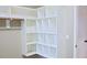 Walk-in closet with custom shelving to maximize organization and storage at 337 Shadowdale Ln, Rolesville, NC 27571