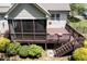 Back deck featuring a screened porch and stairs at 337 Shadowdale Ln, Rolesville, NC 27571