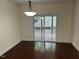 Bright dining room features a modern chandelier and sliding glass doors to a screened deck at 337 Shadowdale Ln, Rolesville, NC 27571