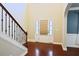 Inviting entryway with hardwood floors, staircase, and a front door with sidelights, creating an elegant first impression at 337 Shadowdale Ln, Rolesville, NC 27571