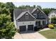 Charming two-story home with stone accents, lush landscaping, and a two-car garage at 337 Shadowdale Ln, Rolesville, NC 27571