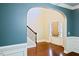 Bright foyer boasts hardwood floors, staircase, and an arched entryway to other rooms with a contemporary design at 337 Shadowdale Ln, Rolesville, NC 27571