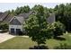 Charming home with a spacious front yard and a two-car garage, surrounded by lush greenery at 337 Shadowdale Ln, Rolesville, NC 27571