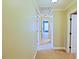 Long hallway with neutral carpet and multiple doorways at 337 Shadowdale Ln, Rolesville, NC 27571