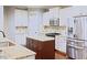 Well-equipped kitchen with stainless steel appliances, granite countertops, and ample cabinet space at 337 Shadowdale Ln, Rolesville, NC 27571