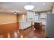 Open-concept kitchen with stainless appliances, granite counters, and a convenient island offers functionality at 337 Shadowdale Ln, Rolesville, NC 27571