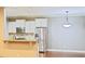 Well-lit kitchen features modern stainless steel appliances, granite countertops, and ample cabinet space at 337 Shadowdale Ln, Rolesville, NC 27571