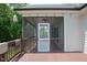 Comfortable screened porch with a ceiling fan and view of the yard at 337 Shadowdale Ln, Rolesville, NC 27571