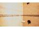 Shower featuring tile surround with decorative tile accent and shower niche at 337 Shadowdale Ln, Rolesville, NC 27571