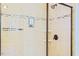Tiled shower with glass enclosure and mosaic accents at 337 Shadowdale Ln, Rolesville, NC 27571