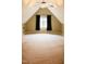 Large attic space with neutral carpeting, natural light, and black out curtains at 3750 Mebane Rogers Rd, Mebane, NC 27302