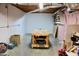 Unfinished basement showcasing open space with work table; ideal for customization and utility at 3750 Mebane Rogers Rd, Mebane, NC 27302