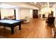 Finished basement featuring a pool table and a seating area at 3750 Mebane Rogers Rd, Mebane, NC 27302