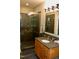 Bathroom features a walk-in shower, granite countertops, vanity, and stylish tile accents at 3750 Mebane Rogers Rd, Mebane, NC 27302