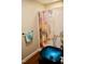 Charming bathroom featuring a distinctive blue glass vessel sink paired with painted artistic shower curtain at 3750 Mebane Rogers Rd, Mebane, NC 27302