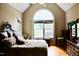 Spacious bedroom with hardwood floors, a large window, and elegant furnishings at 3750 Mebane Rogers Rd, Mebane, NC 27302