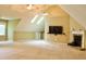 Large bonus room offering flexible space with natural light and fireplace at 3750 Mebane Rogers Rd, Mebane, NC 27302