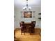 Charming dining area with a wooden bar, seating, and decorative lighting fixtures at 3750 Mebane Rogers Rd, Mebane, NC 27302