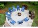 Outdoor fire pit area with blue Adirondack chairs, perfect for gatherings and relaxation at 3750 Mebane Rogers Rd, Mebane, NC 27302
