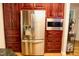 Kitchen featuring stainless steel refrigerator and wooden cabinets at 3750 Mebane Rogers Rd, Mebane, NC 27302