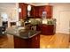 Kitchen featuring granite countertops, wooden cabinets and hardwood floors at 3750 Mebane Rogers Rd, Mebane, NC 27302