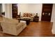 Cozy living room with hardwood floors, love seats and built-in shelving for a warm inviting ambiance at 3750 Mebane Rogers Rd, Mebane, NC 27302