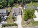Aerial view of home showing front yard, driveway, landscaping, and surrounding trees at 3914 Old Chapel Hill Rd, Durham, NC 27707