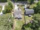 Aerial view of home with lush landscaping, driveway and surrounding neighborhood at 3914 Old Chapel Hill Rd, Durham, NC 27707