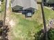 Aerial view of a backyard featuring a hot tub on the patio and a grassy area surrounded by a wood privacy fence at 3914 Old Chapel Hill Rd, Durham, NC 27707