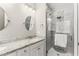 Modern bathroom features dual sinks with granite countertops and a glass-enclosed shower at 3914 Old Chapel Hill Rd, Durham, NC 27707
